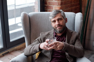 Bearded man with whisky glass