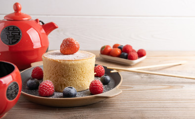 Trendy asian food, Fluffy homemade japanese souffle pancakes, hotcakes with raspberry, blackberry with copy space.