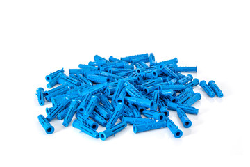A bunch of blue plastic building dowels close-up on a white background.
