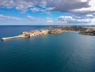 Fototapeta premium Fort Ricasoli at the bay of mediterranean sea, Malta