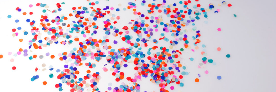 Panoramic image. Colorful confetti on white background. Happy celebration party