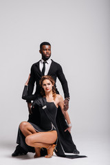 Couple dancers posing over white background. Dance school concept