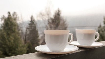 cup of coffee on wooden table