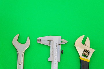 Set of tools for plumbing isolated on green background with space for advertising