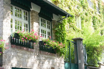 Stone house with flowers in Montmartre