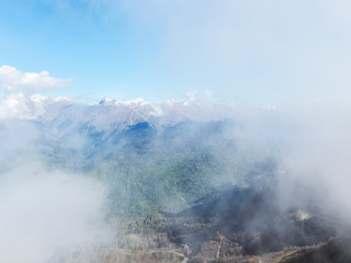 Fototapeta na wymiar Beautiful view of a mountain valley in a cloudy haze