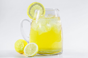 Lemonade or ice tea lemon in a white light background