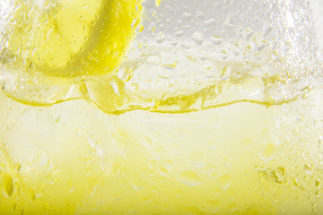Lemonade or ice tea lemon in a white light background