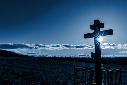 Church cross in the sun. classic blue color of the year 2020 . space for text. background