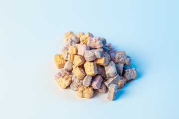 children's vitamins in the form of animals on a white background with light blue color