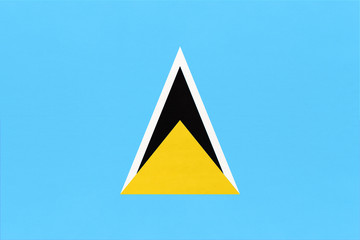 Saint Lucia national fabric flag, textile background. Symbol of international caribbean world country.