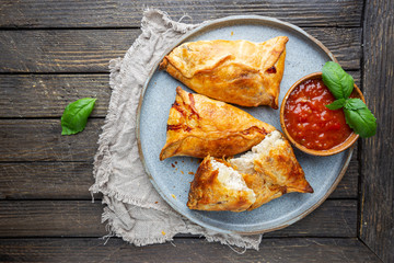 Asian food Samsa or samosas with chicken fillet on a plate. Top view