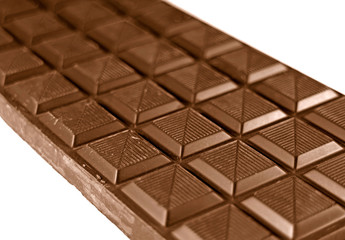 Closeup a bar of delicious chocolate bar isolated on white background