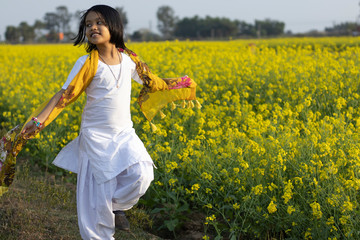 child and mustard flower