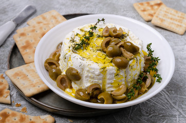 Soft cheese with olives