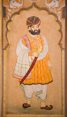 Honorable Indian man in traditional clothes - ancient wall painting at Patwon Ki Haveli in Jaisalmer, Rajasthan, India