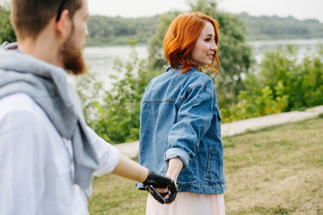 Happy married middle age couple walking in a park