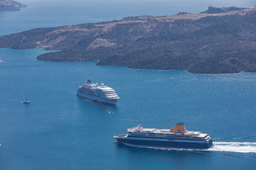 Beautiful landscape with sea view. Cruise ships at the sea near the islands. Santorini island, Greece.