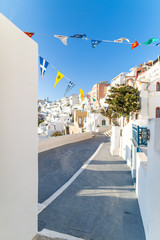 Santorini, Greece. Famous view of traditional white architecture Santorini landscape with blue sky. Summer vacations background. Luxury travel tourism concept. Amazing summer destination