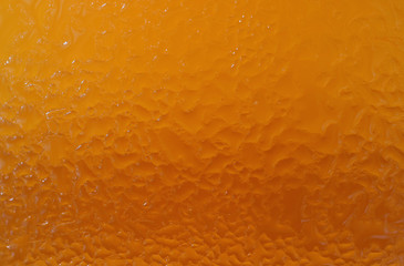 Condensation on the Glass of Amber Color Cold Weizen Beer