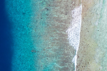 Fototapeta na wymiar Sea ocean aerial view, top view, amazing marine nature background. Reef and coastal view, shades of blue