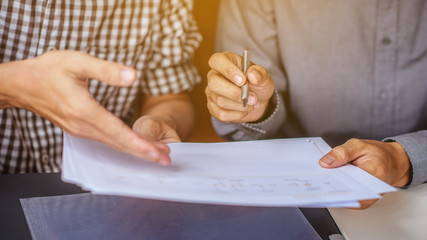 Two young engineers are working on consultations.