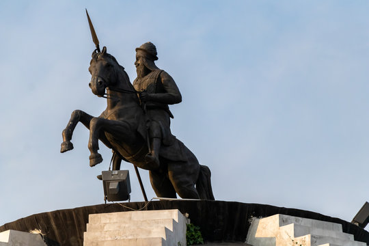 low angle photography of Sikh Warrior Bhai Fateh Singh statue sitting on horse against sky in the background. historical concept.