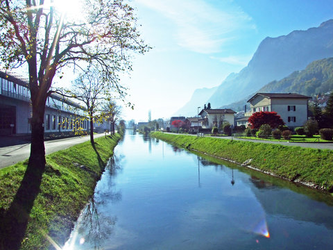 The river Rheintaler Binnenkanal in a village of R&uuml;thi SG (Ruthi SG or Ruethi SG) and in the Rhine river valley (Rheintal) - Canton of St. Gallen (SG), Switzerland