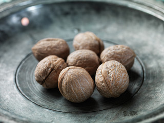 walnut on a metal plate