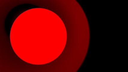 Close-up of a lamp with red light on a black background.