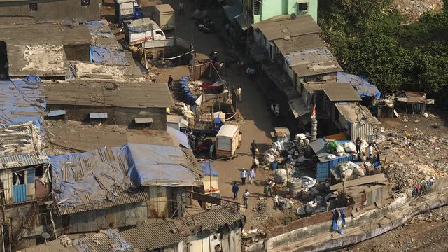 Alleyway in slums of Mumbai, India. Closeup aerial view.