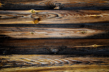 Naklejka premium Old pine horizontal boards. The wood texture is brown-yellow with rings and traces of knots. Wooden abstract background, structure.