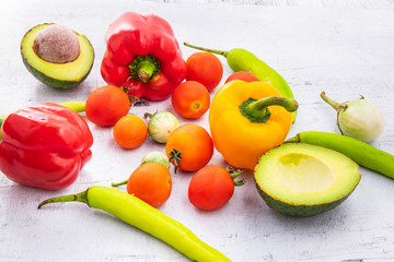 Vegetables and fruits On a white wooden background.
