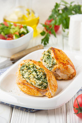 Chicken fillet stuffed with cottage cheese (ricotta, feta) and herbs (parsley, spinach, dill). Delicious homemade food, healthy