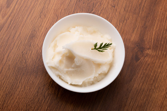 small bowl of lard on wooden table
