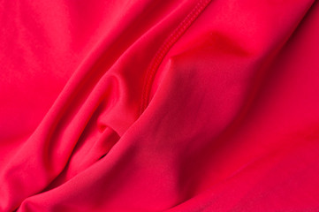 Obraz premium Fragment of crumpled red polyester fabric