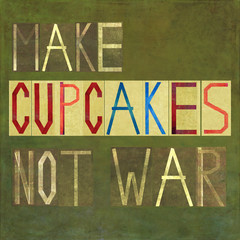 Textured image depicting the words: Make cupcakes not war