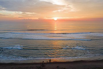 Aerial from a beautiful sunset at the west coast on Bali Indonesia