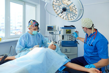 Man surgeon at work in operating room