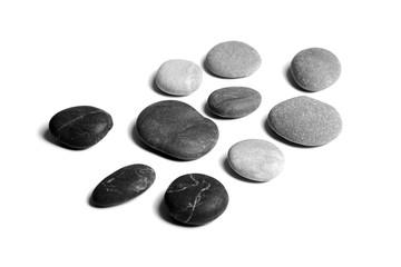 Pebbles, black and gray color smooth sea stones isolated on white background