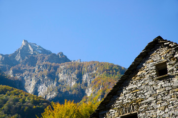 Rustic House and Mountain Peak in Ticino, Switzerland.