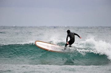 Korean Winter surfers at the Buheung-ri beach in Namjeong-Myeon, Yeongdeok-gun, South Korea.