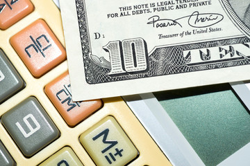 Calculator and Ten Dollar Bill.