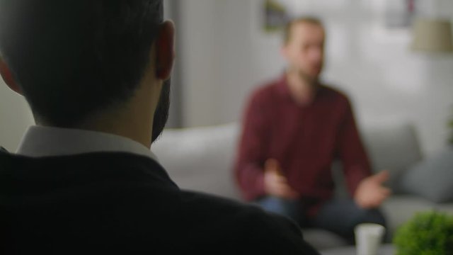 sad young man in Therapy session - Help, support, medical