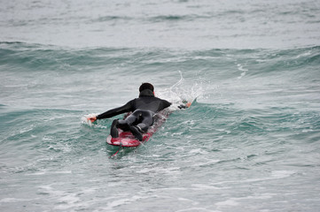 Korean Winter surfers at the Buheung-ri beach in Namjeong-Myeon, Yeongdeok-gun, South Korea.