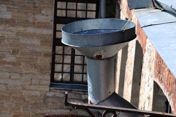 Steel Round Rainwater Hopper. Rainline rainwater drainage system on the roof