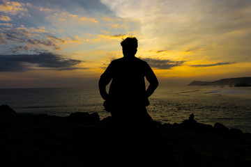Naklejka na ściany i meble silhouette of man at sunset