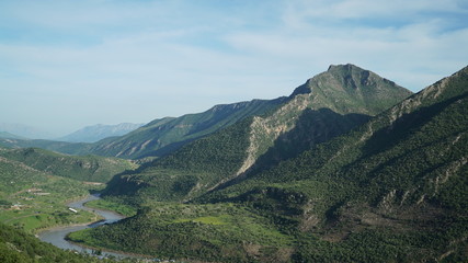 A scenery of The northern Iraq ( Iraqi Kurdistan region)'s nature valley river and mountains in spring time