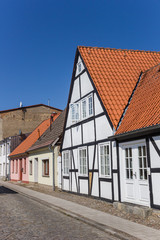 Fototapeta na wymiar White half timbered house in the old town of Grimmen, Germany