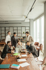 people hold conference at office. Business executive delivering presentation to colleagues or business partners during meeting or in-house business training, explaining business plans